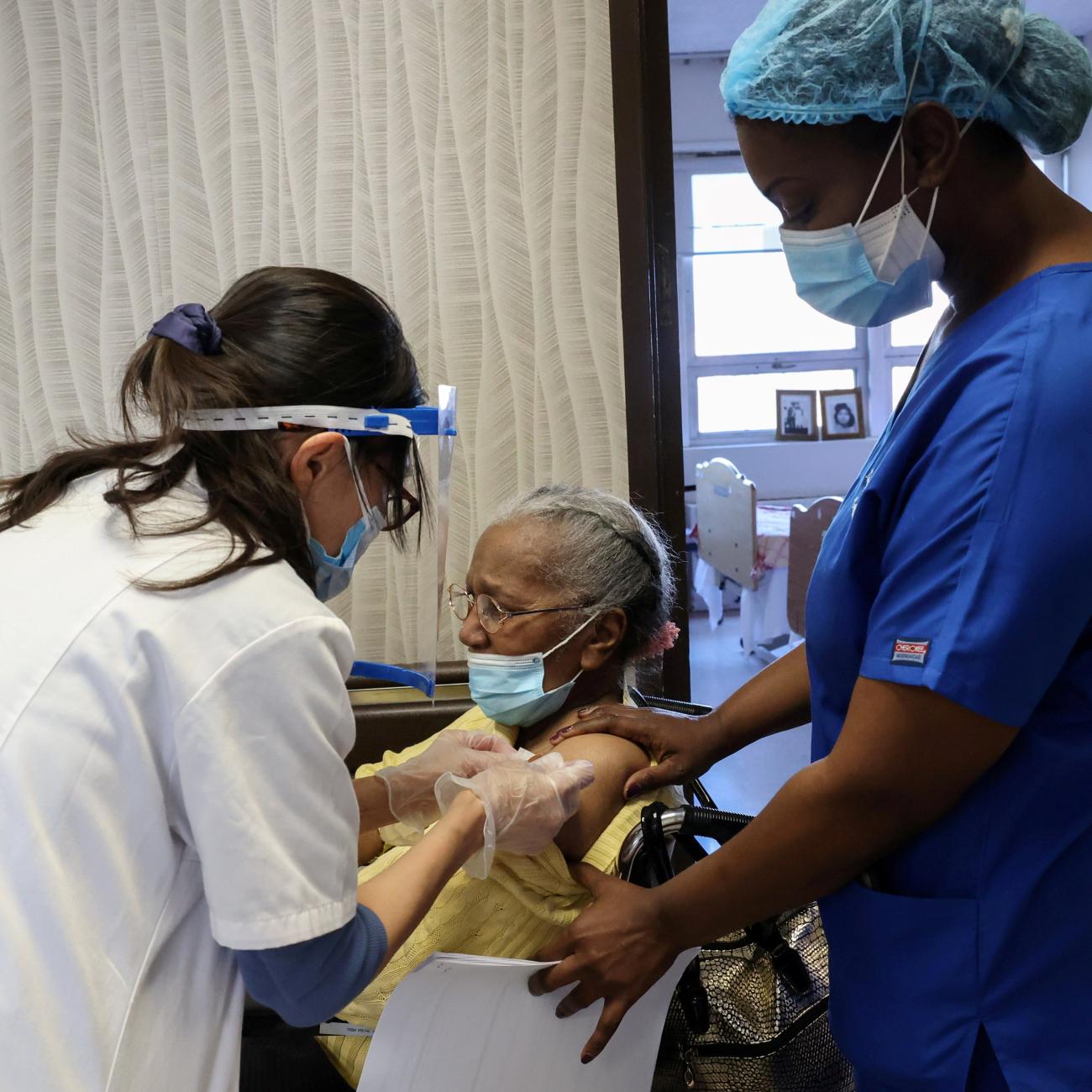 A nursing home resident receives a shot of the coronavirus disease (COVID-19) vaccine at King David Center for Nursing and Rehabilitation, a nursing home facility, in Brooklyn's Bath Beach neighborhood in New York City, U.S. January 6, 2021. 