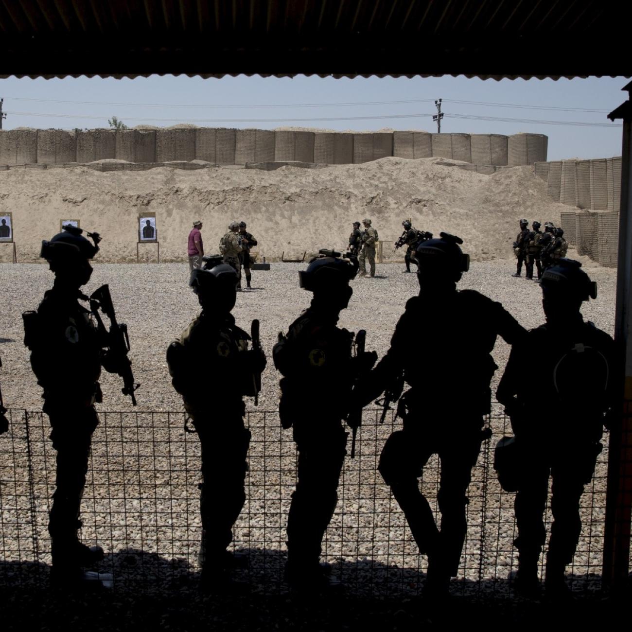 Members of the Iraqi military train at the Counter Terrorism Service training location, as observed by U.S. Defense Secretary Ash Carter in Baghdad