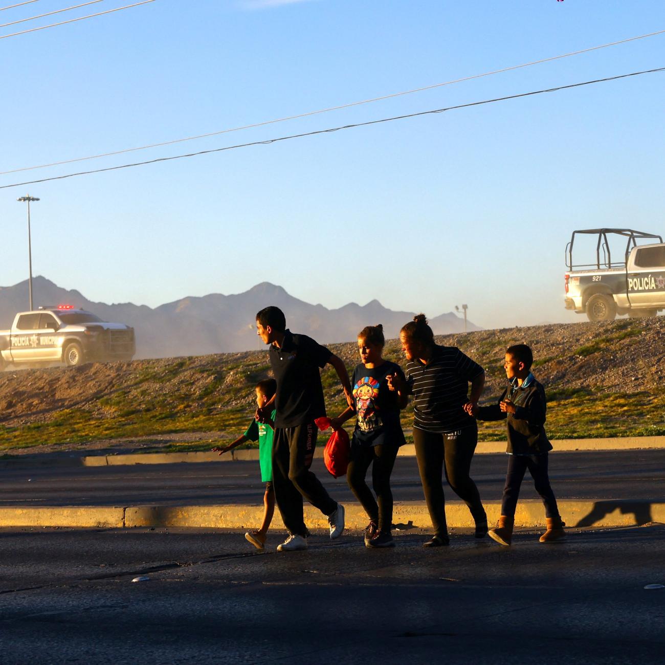 Migrants from Venezuela try to evade an operation carried out by police and agents of the National Institute of Migration (INM) of Mexico on the banks of the Rio Bravo River, the border between the U.S. and Mexico, in Ciudad Juarez, Mexico, October 6, 2023.