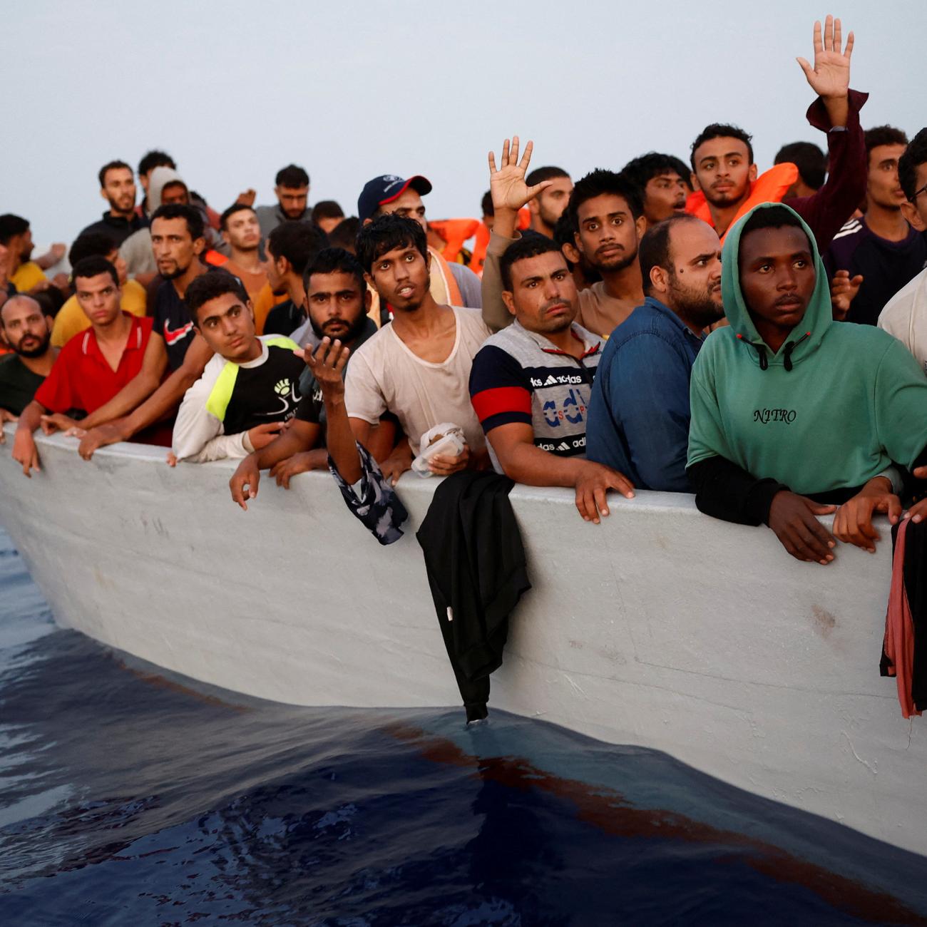 Multiple refugees in a boat.