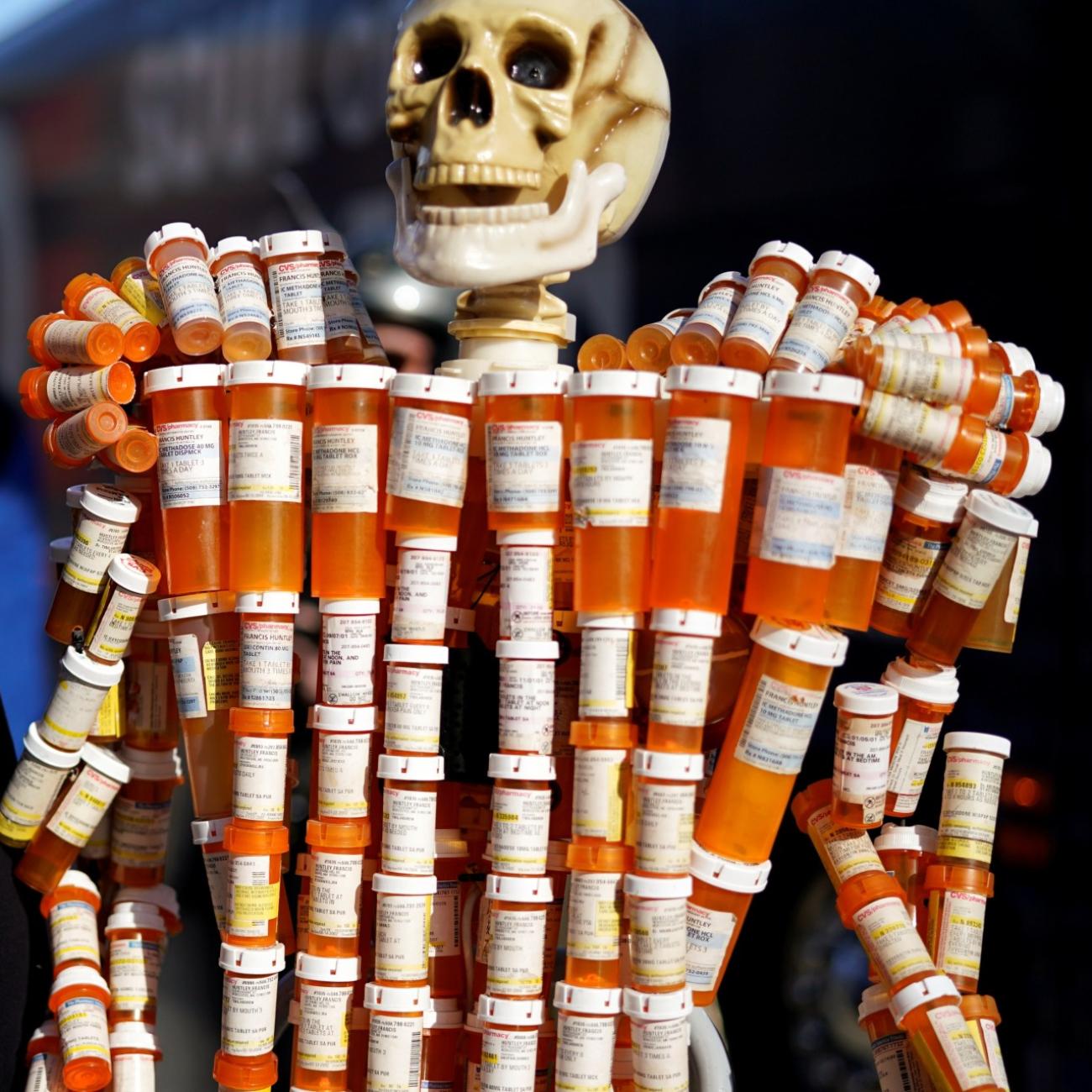 Frank Huntley looks at his sculpture made out of the opioid pill bottles he got when addicted, in Somersworth, New Hampshire on February 5, 2020.