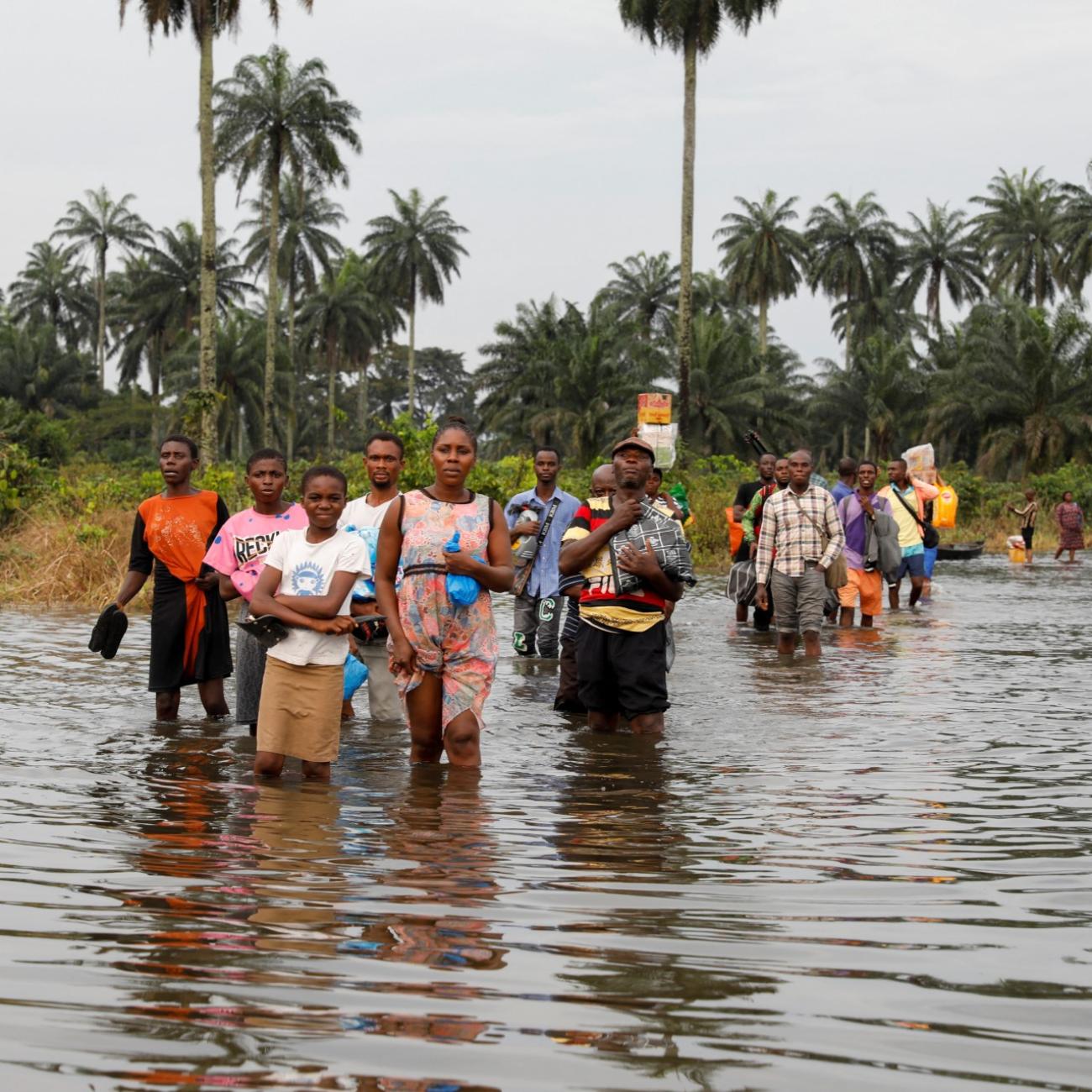 Residents wade through flood water in Obagi community Residents wade through flood water in Obagi community,