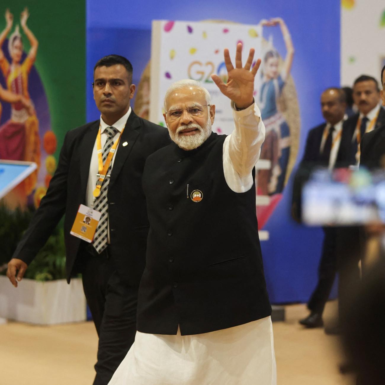 Indian Prime Minister Narendra Modi waves as he visits International Media Center, on the second day of the G20 summit in New Delhi, India,