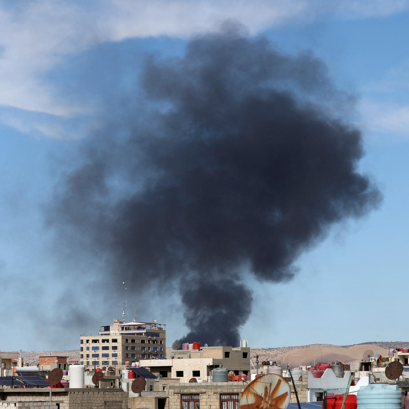 Smoke rises from Syria's Kurdish-controlled northeast city of Qamishli.