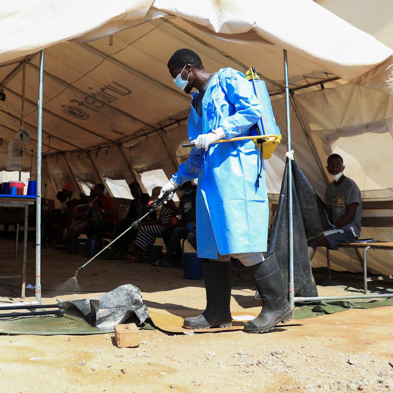 A health worker disinfects a cholera tent at Kuwadzana Polyclinic in Harare.