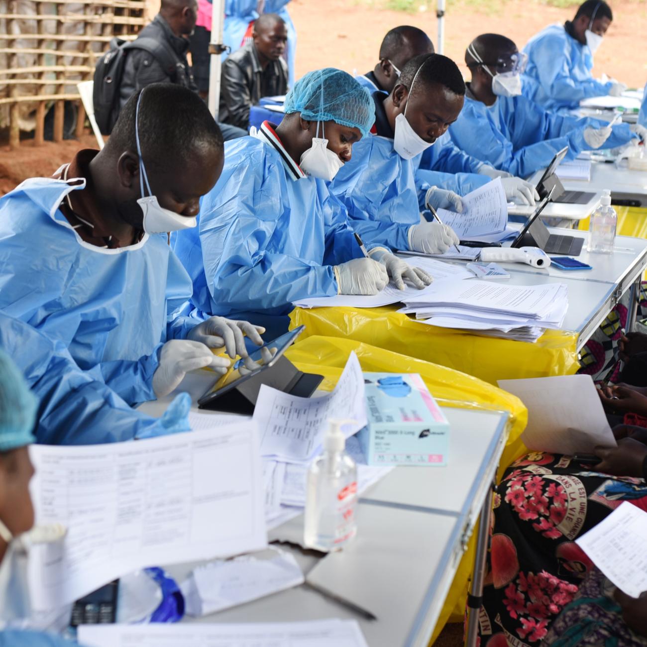 Congolese health workers register people before they are vaccinated against ebola.