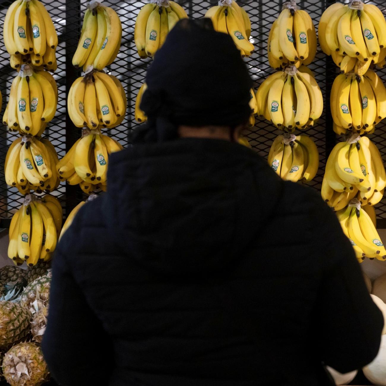 A person shops in a supermarket selling fruit and vegetables in Manhattan, New York City, on March 28, 2022