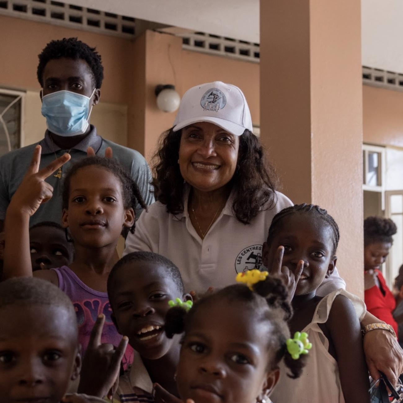 Marie Marcelle Deschamps is seen with a group of children in Haiti, in 2021.