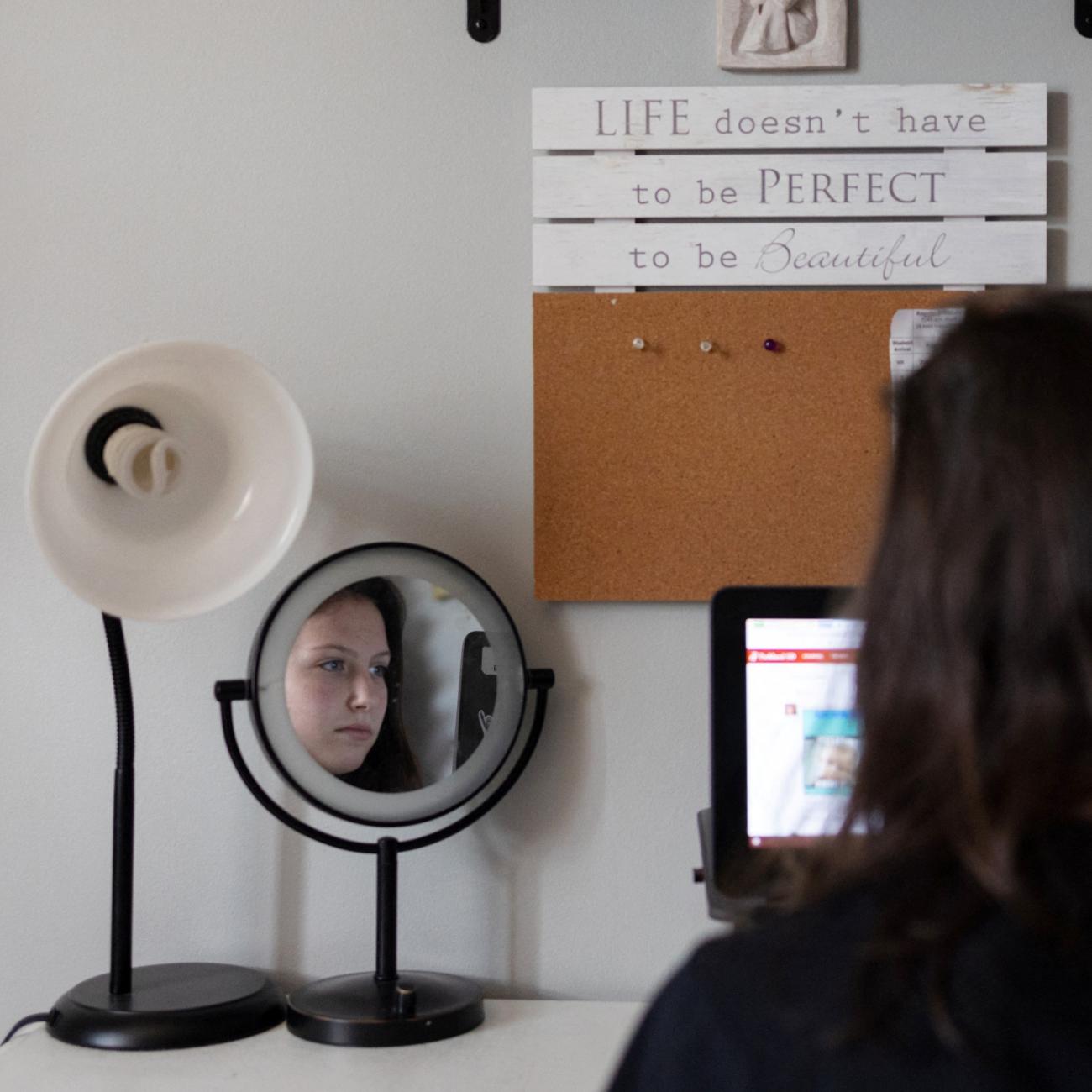 Sara Lundberg, who struggled with anxiety and depression during the COVID pandemic, is seen in her bedroom.