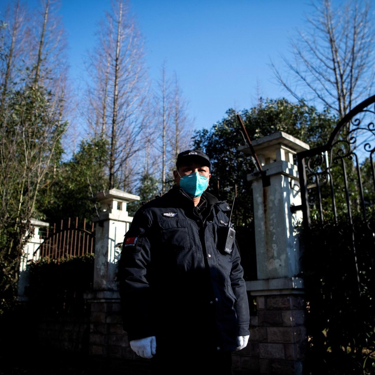 A guard stands at the gate of the Shanghai Public Clinical Center Shanghai, where the coronavirus patients are quarantined, in Shanghai, China February 17, 2020.