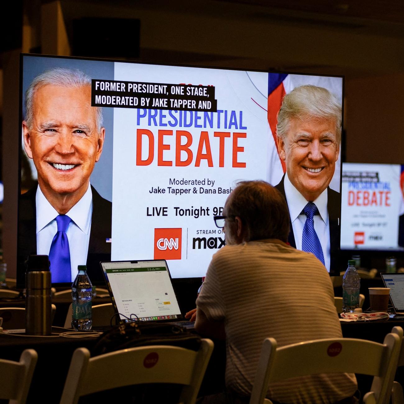 Media crews work at the press room in the McCamish Pavilion on the Georgia Institute of Technology campus ahead of the first 2024 presidential debate between U.S. President Joe Biden and former U.S. President Donald Trump in Atlanta, Georgia, June 27, 2024.