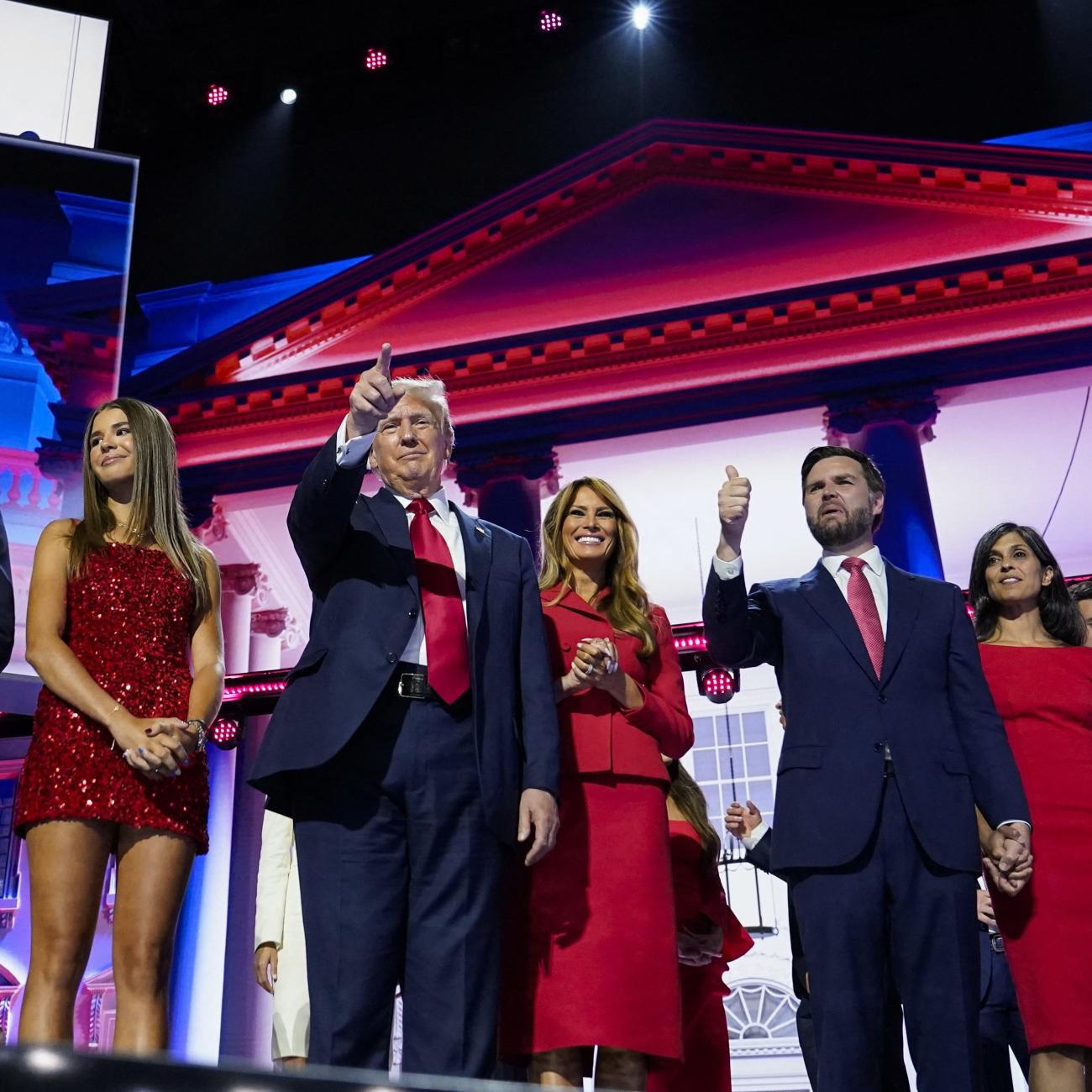 Republican presidential nominee and former President Donald Trump and Republican vice presidential nominee J.D. Vance stand on stage with their families.