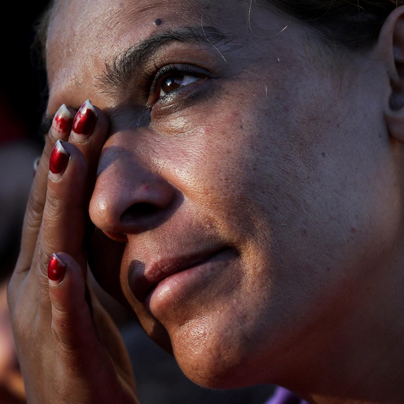 Amira, reacts during an interview at Beirut's central Martyrs' Square where many families fled from the Israeli strikes in southern Beirut.