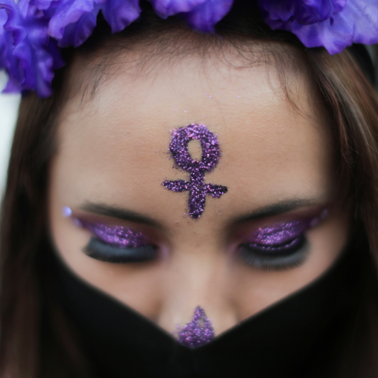 A woman wears a face mask during a protest on the Day of the Dead against gender violence and femicide, in Mexico City, Mexico, November 2, 2020.
