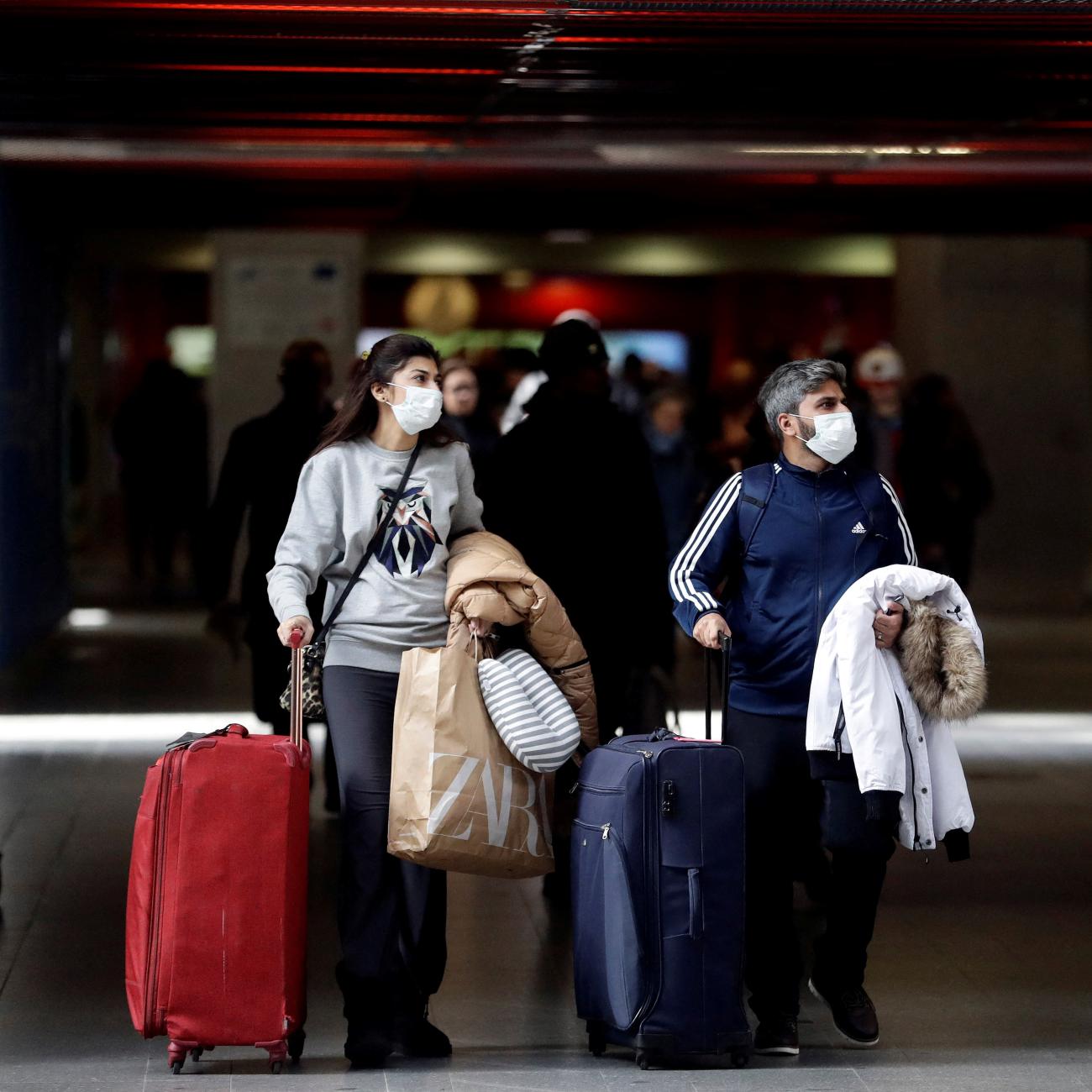 eople wearing masks are seen at a railway station, as the Czech government bans most travel to contain the spread of the COVID-19.