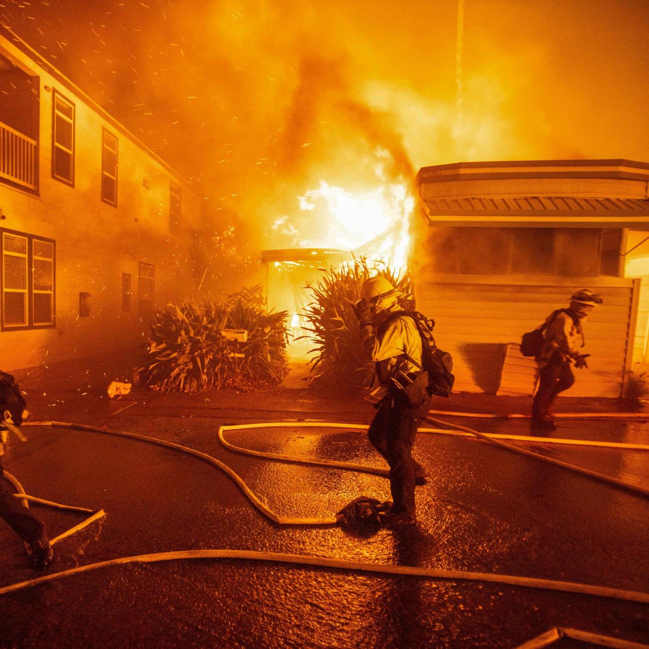 Firefighters battle the Palisades Fire as it burns during a windstorm, on the west side of Los Angeles, California, on January 7, 2025. 