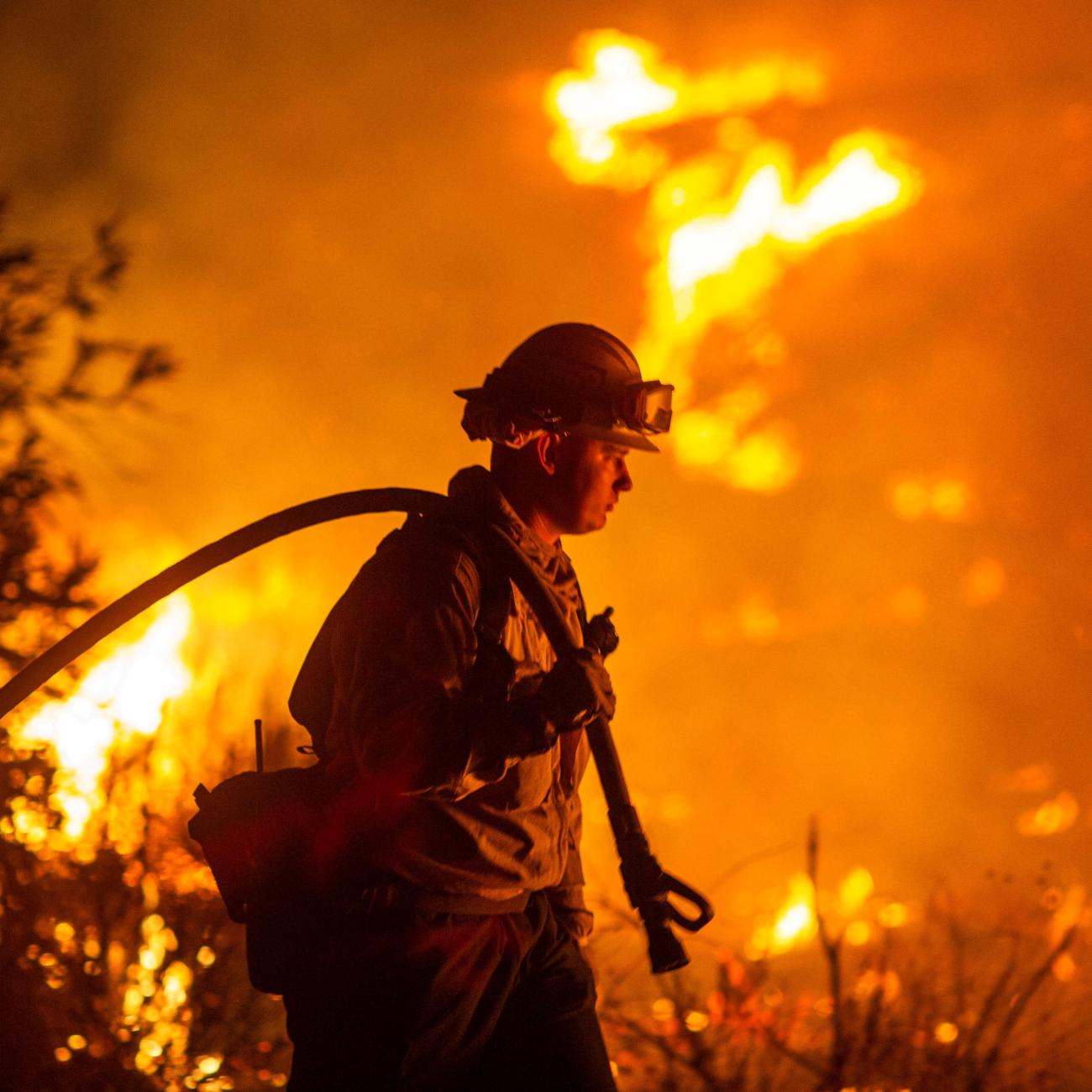A firefighter battles the Hughes Fire near Castaic Lake, California, on January 22, 2025. 