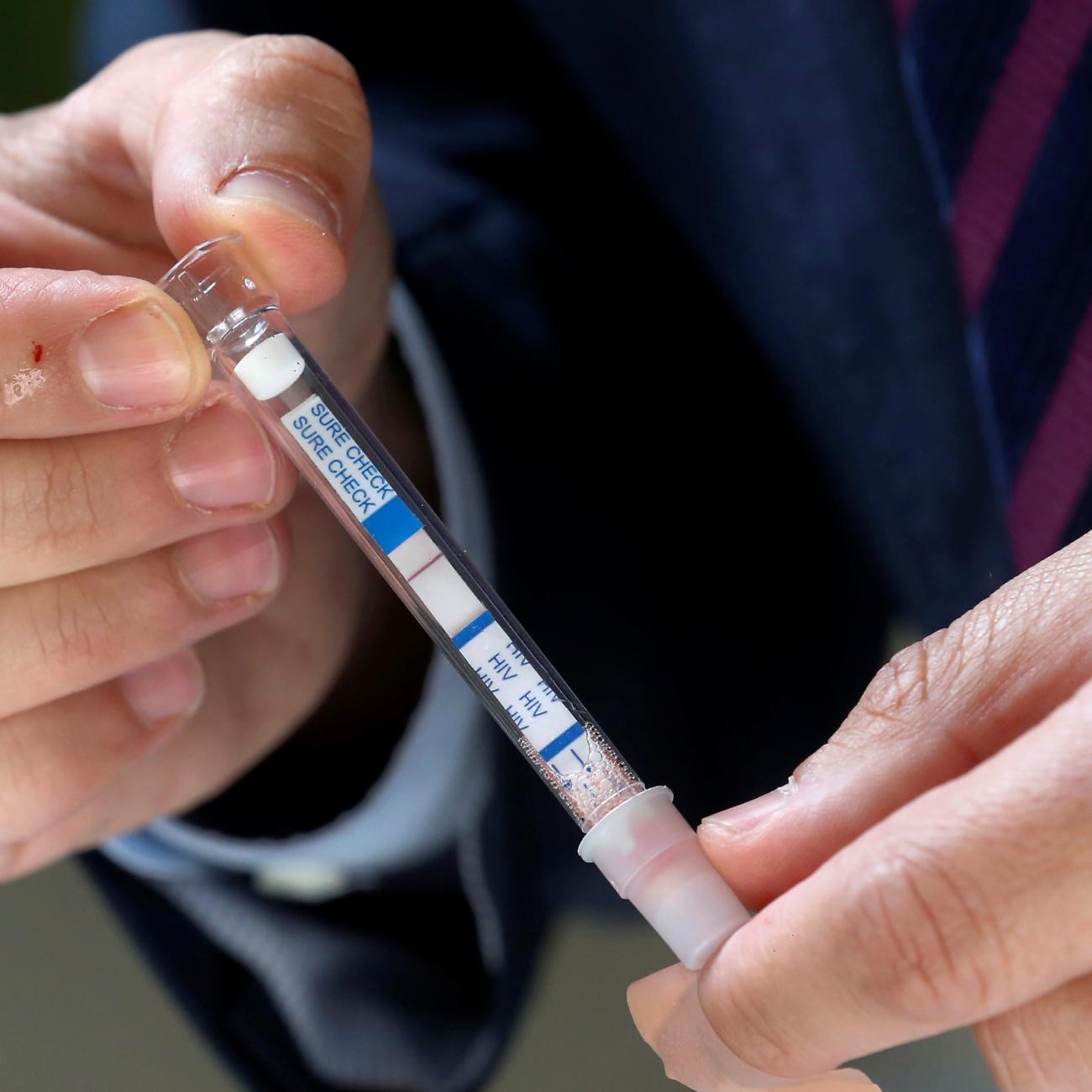 Chilean Senator Francisco Chahuan presents an HIV self-test kit, in effort to encourage people to check their health, in Valparaiso, Chile, on December 11, 2018.