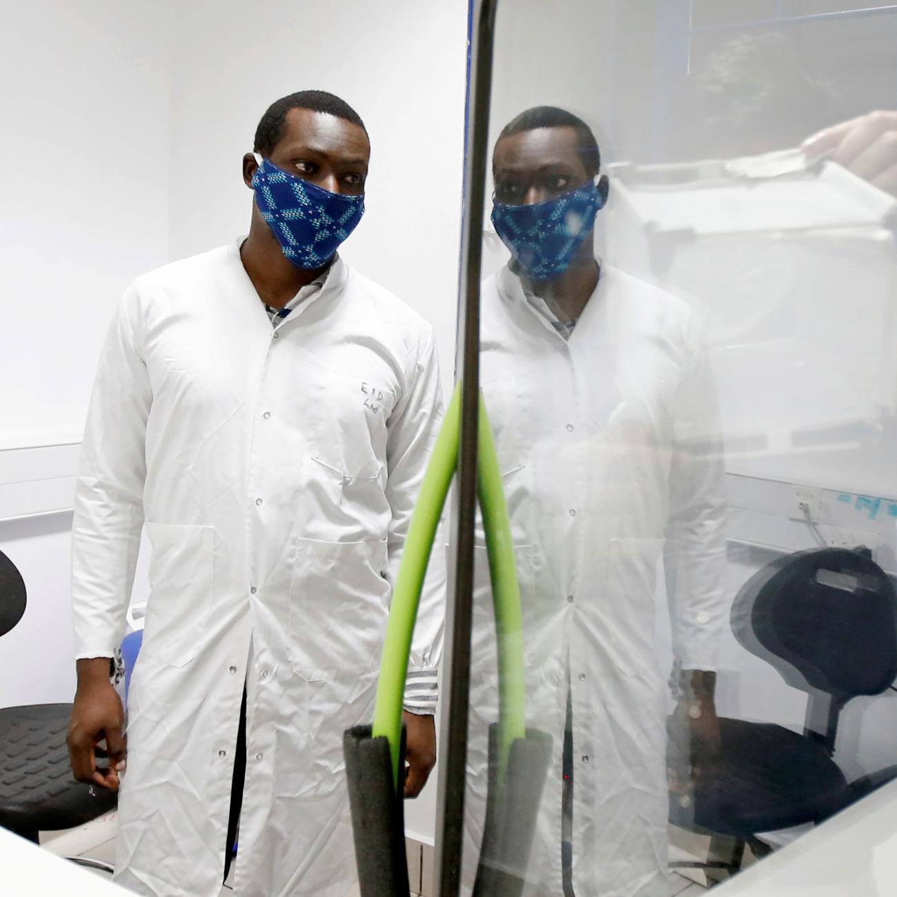 Researchers work on a microbe they say can protect mosquitoes from malaria, at the International Centre of Insect Physiology and Ecology headquarters, in Nairobi, Kenya on, May 11, 2020. 