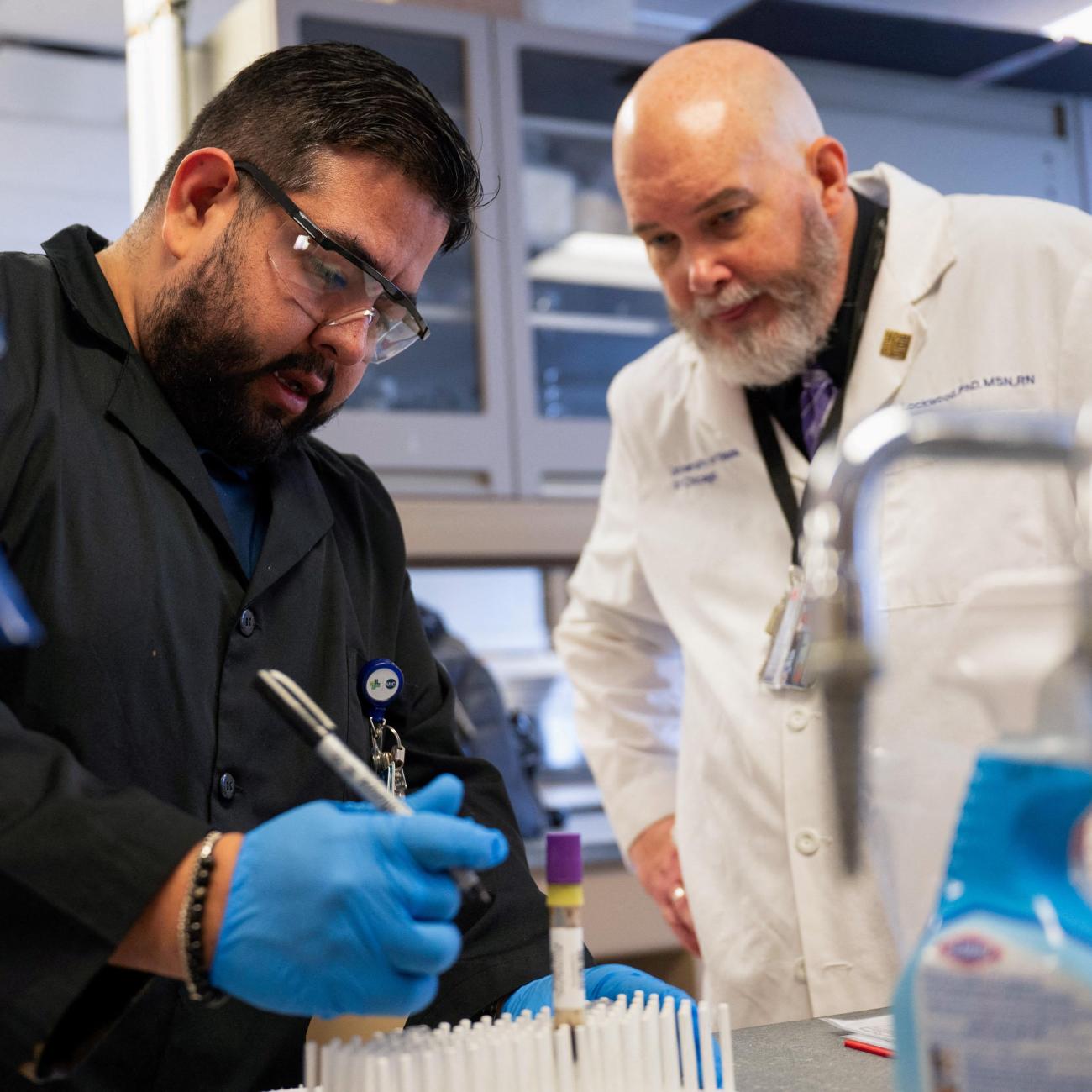 A professor at the University of Illinois Chicago College of Nursing, works with a research specialist, as a part of a study under a RO1 federal grant, in Chicago, Illinois, on February 28, 2025.