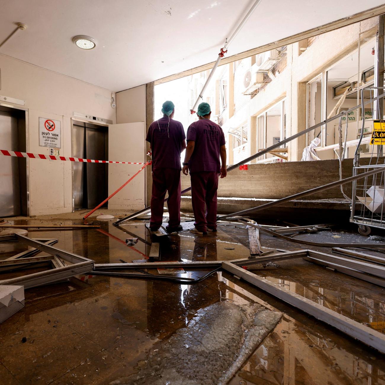 Medical staff inspect the damage at an impact site, following a missile strike from Iran on Israel, at Soroka Medical Center, in Beersheba, Israel, on June 19, 2025.