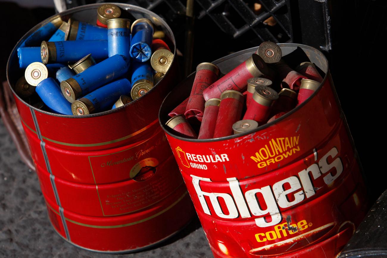 Old coffee cans of shotgun shells dropped off to the Los Angeles County Sheriff's Department at the “Gifts for Guns” buyback in Compton, California on January 21, 2013. Picture shows two bright red, rusted out coffee tins filled to the brim with shotgun shells, red shells in the first tin, blue in the second. REUTERS/David McNew