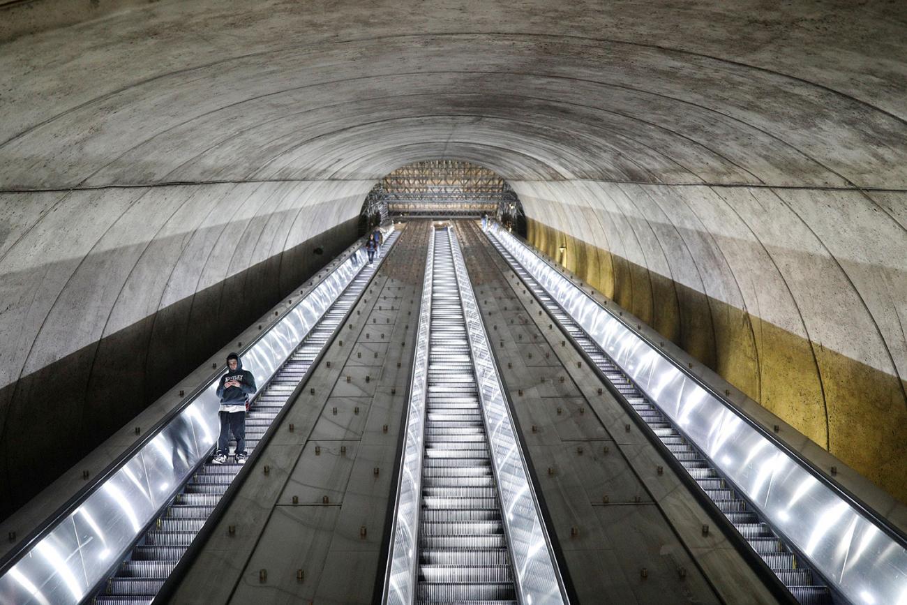 A usually bustling Metro station in Bethesda, Maryland nearly empty at rush hour last week, when Governor Larry Hogan ordered the shutdown of all bars and restaurants in the state due to coronavirus. The picture shows a long escalator tube almost empty. REUTERS/Tom Brenner 