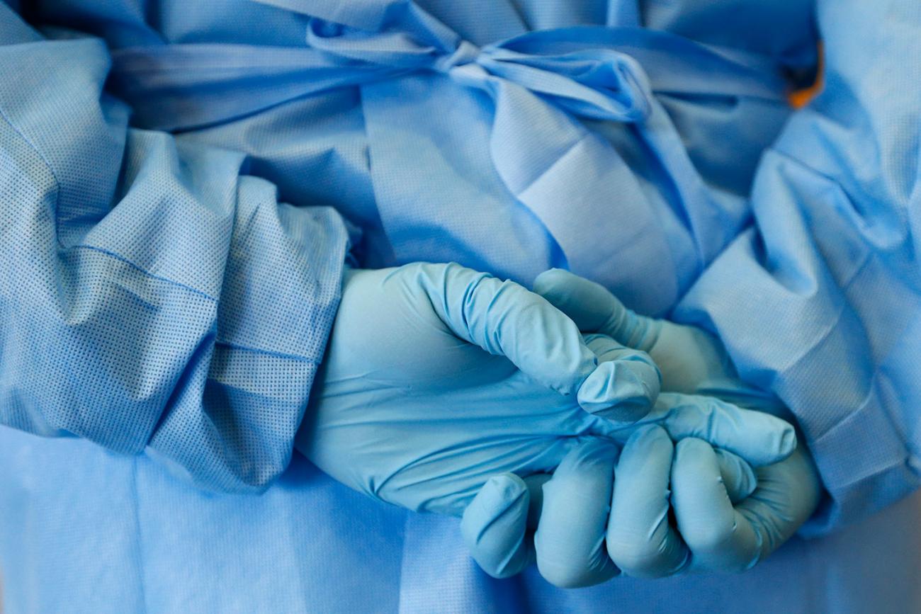 The hands of a nurse are seen during a demonstration of an isolation chamber for the treatment of infectious diseases at the Germany army medical centre, Bundeswehr Clinic, in Koblenz, Oct. 16, 2014. 