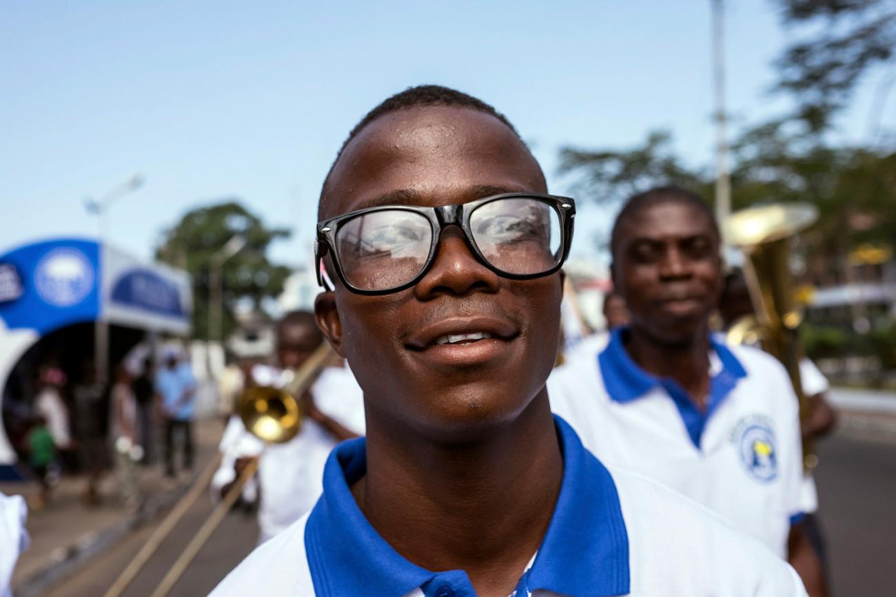 Ebola survivor Musa Pabai walks in an Ebola Survivors Valentine’s Day parade in Monrovia, Liberia, on February 14, 2015. Pabai survived an outbreak that killed nearly ten thousand people across West Africa. Picture shows Musa smiling at the camera as he walks in the parade. REUTERS/Ricci Shryock