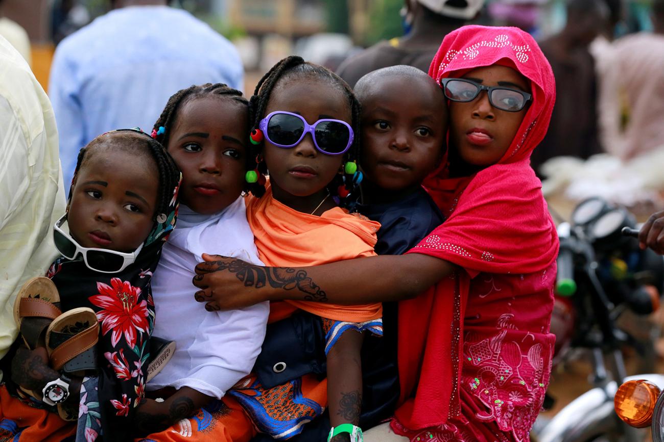 Children are seen on a bike after Muslims in Nigeria perform Eid prayer following the global outbreak of coronavirus disease (COVID-19) in Nasarawa May 24, 2020. The photo shows four children crammed together on a bike. REUTERS/Afolabi Sotunde