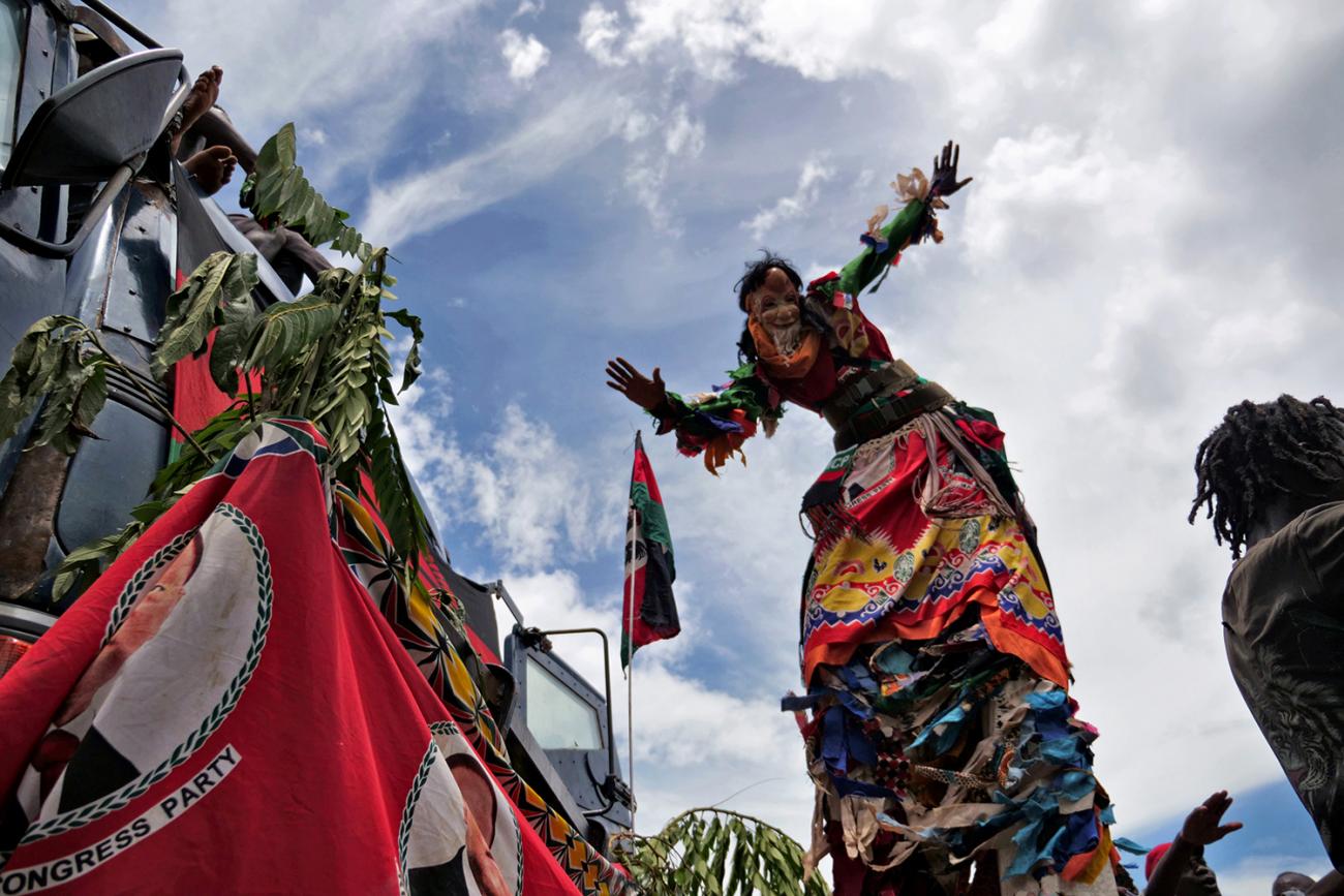 Opposition supporters celebrate in Lilongwe, Malawi, on February 4, 2020 after a court annulled the May 2019 presidential vote that declared Peter Mutharika the winner—ordering a new vote June 23. The photo shows a man in a stilt costume dancing. This is a striking photo. REUTERS/Eldson Chagara 