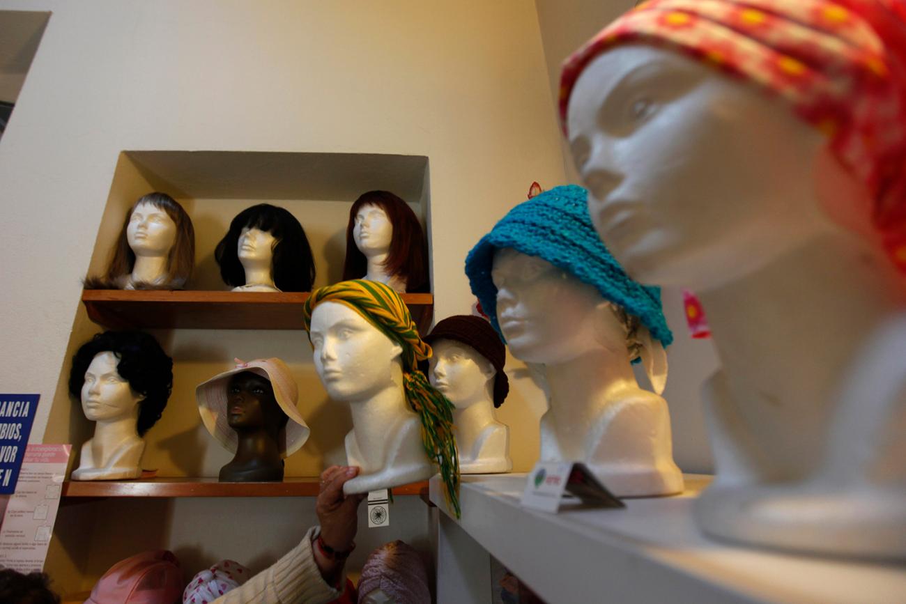 Wigs and head scarves for patients with breast cancer are seen on mannequins at a center run by the "Reto" Group for Full Recovery of Breast Cancer in Mexico City October 18, 2012. The photo shows a room with mannequin heads and wigs. REUTERS/Edgard Garrido