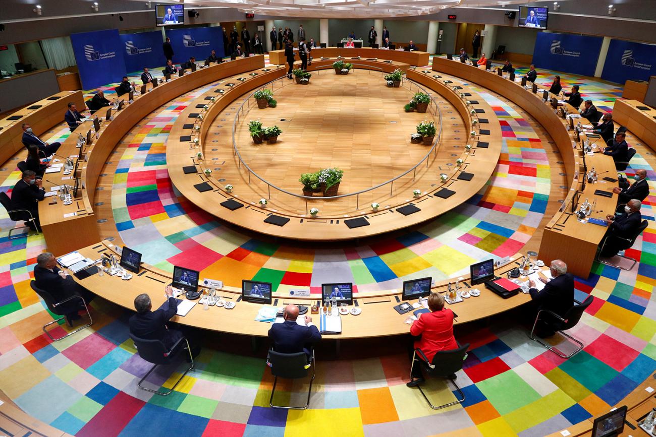 Where policy meets health: European Union leaders take part in the first face-to-face EU summit since the coronavirus disease (COVID-19) outbreak began, in Brussels, Belgium, on July 17, 2020. The photo shows a large round table from above with various leaders seated far apart from one another. REUTERS/Francois Lenoir