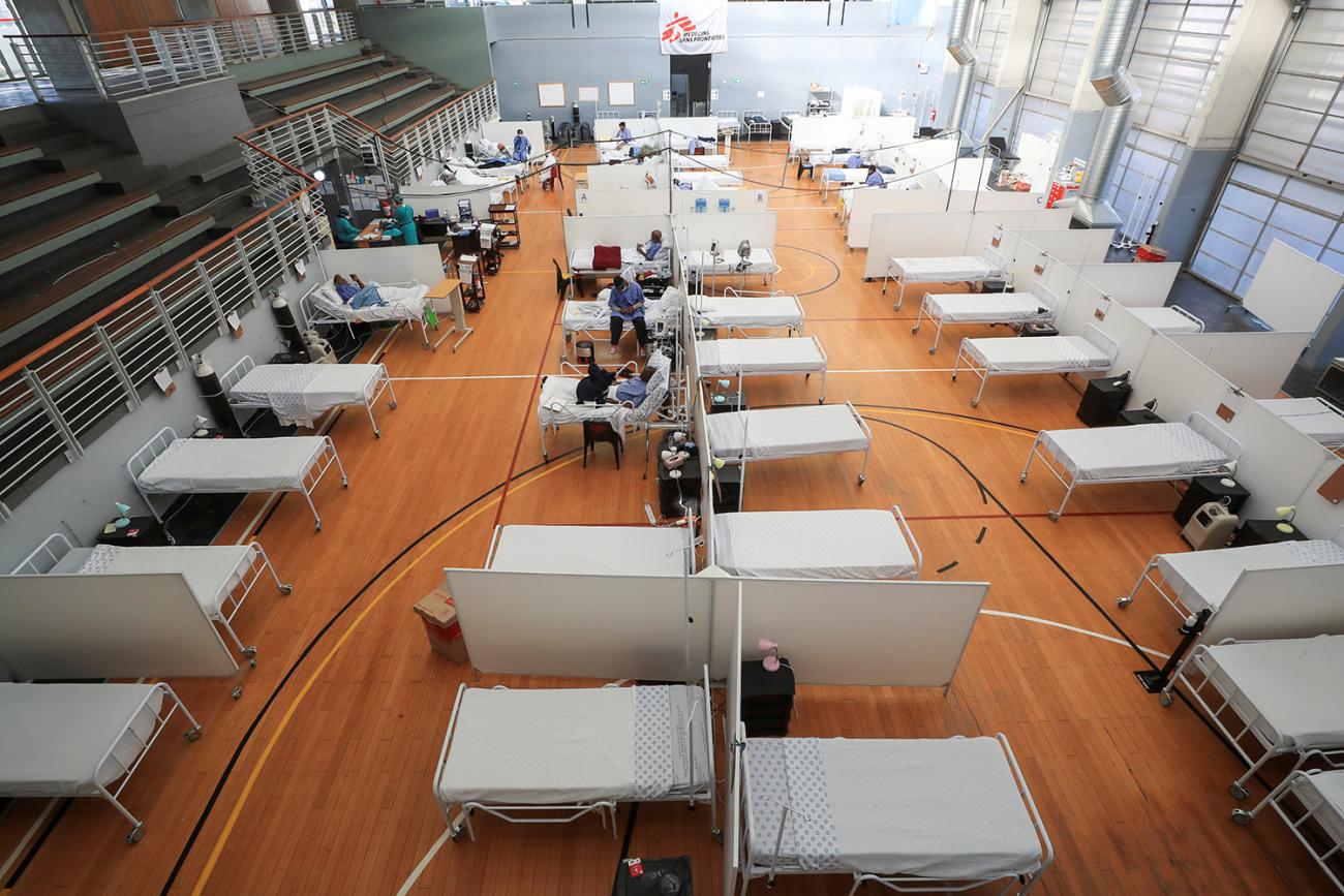 Beds at a temporary field hospital set up in a sports complex by Medicines Sans Frontieres during the coronavirus outbreak in Khayelitsha township near Cape Town, South Africa, on July 21, 2020. The photo shows a large gymnasium with lots of beds in rows. REUTERS/Mike Hutchings
