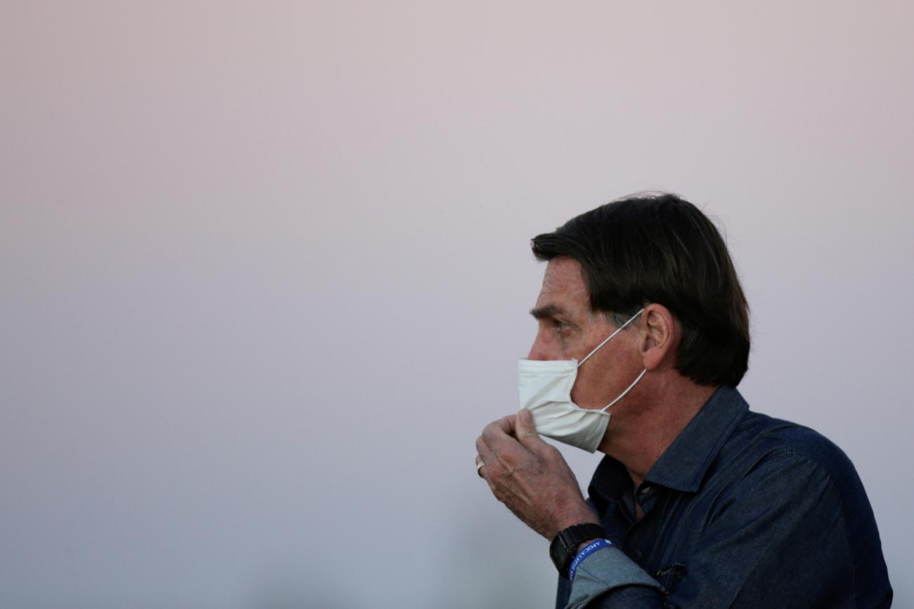 President Jair Bolsonaro is seen during a ceremony to lower the Brazilian National flag down for the night, at the Alvorada Palace, amid the coronavirus disease (COVID-19) outbreak, in Brasilia, Brazil, July 15, 2020. 