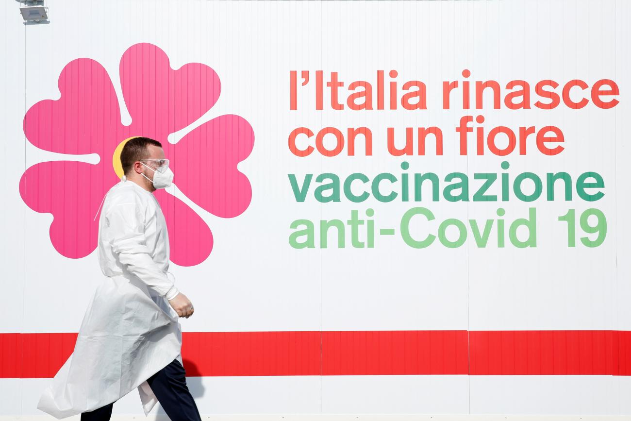 A man walks outside a tent during preparations to turn the long-term car park at Fiumicino airport into a coronavirus disease (COVID-19) vaccination centre, in Rome, Italy, February 5, 2021. 