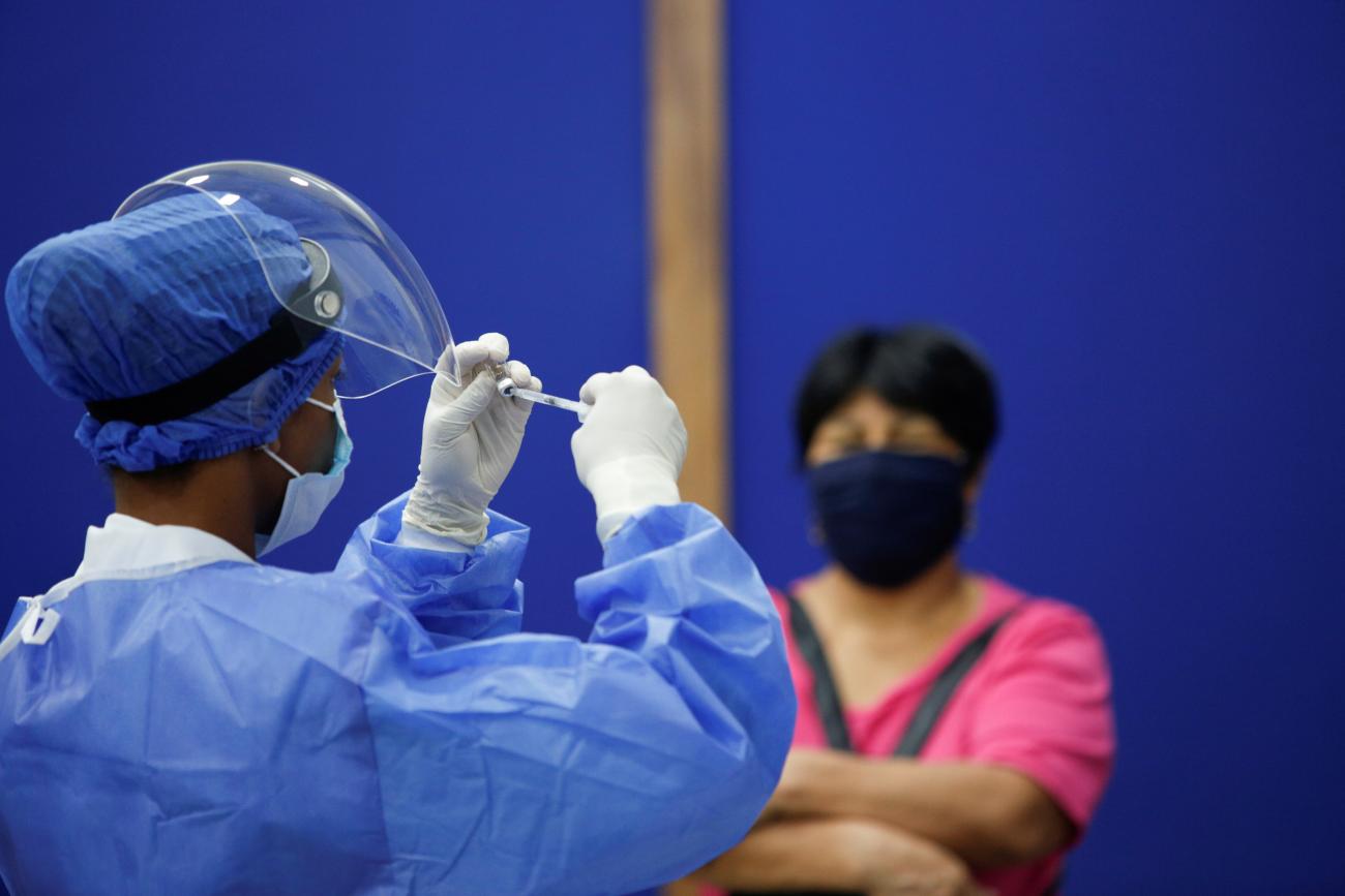 A nurse prepares a dose of China's Sinovac Biotech vaccine against the coronavirus disease (COVID-19) during a mass vaccination program for the elderly, at the Bolivarian Technology Institute in Guayaquil, Ecuador April 15, 202