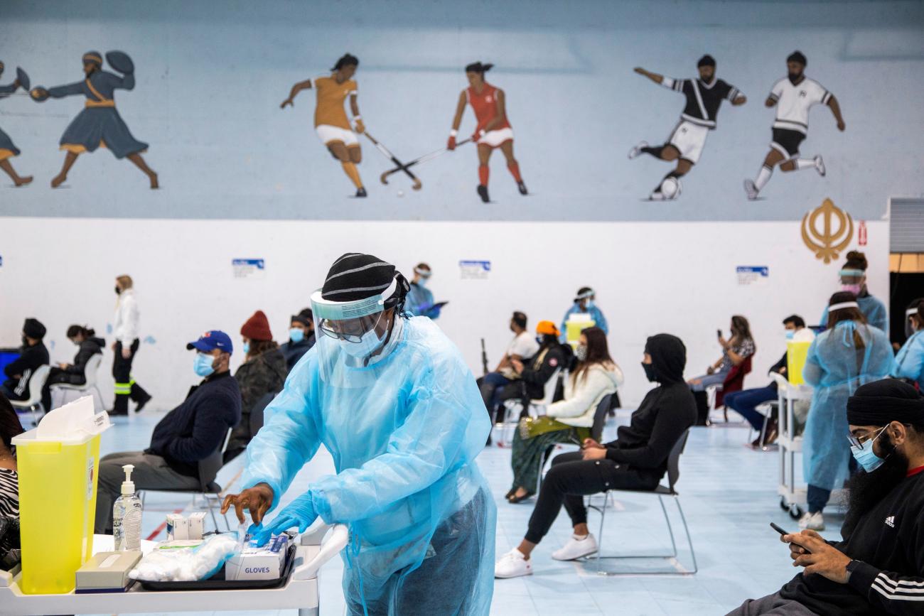 Healthcare workers from Switch Health administer the Pfizer/BioNTech COVID-19 vaccine at the Ontario Khalsa Darbar pop-up vaccination clinic, set up with support from Amazon Canada, at the Sikh Gurudwara in Mississauga, Ontario, Canada May 4, 2021.