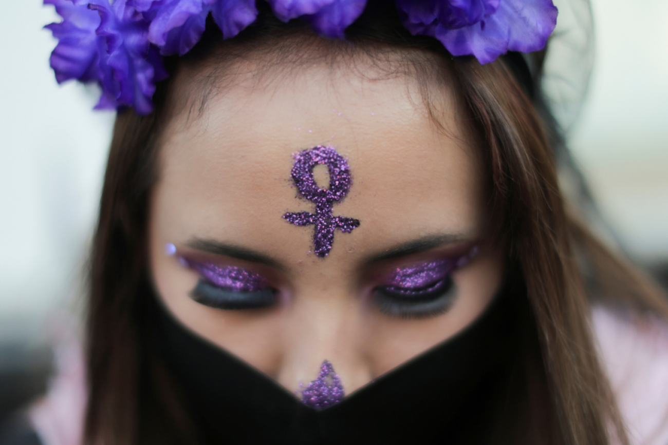A woman wears a face mask during a protest on the Day of the Dead against gender violence and femicide, in Mexico City, Mexico, November 2, 2020.