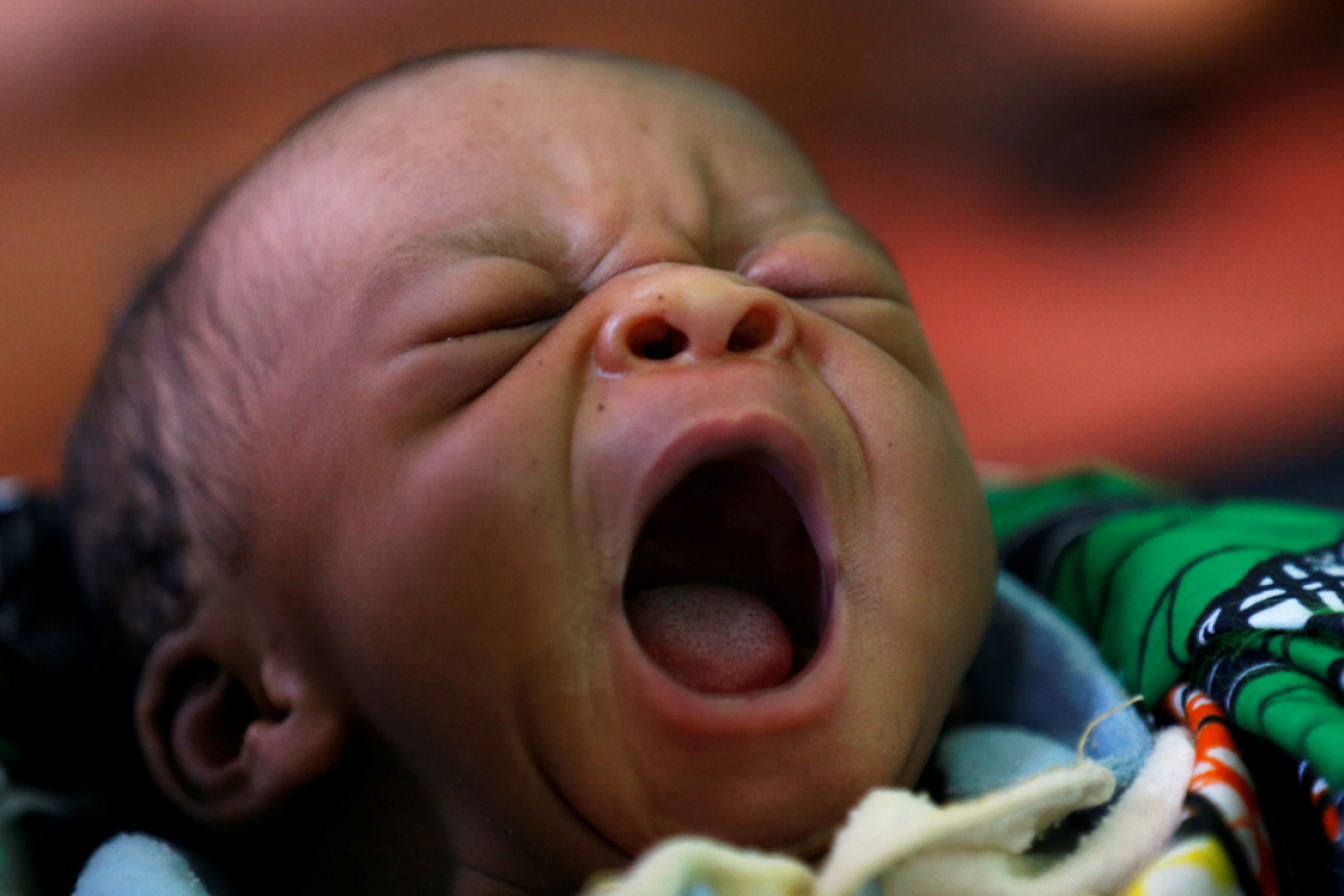 A newborn Congolese baby yawns inside the maternity ward at the Kapangu maternity health centre in Kaniki-Kapangu, in Kasai Oriental Province, in the Democratic Republic of Congo, March 15, 2018. REUTERS/Thomas Mukoya