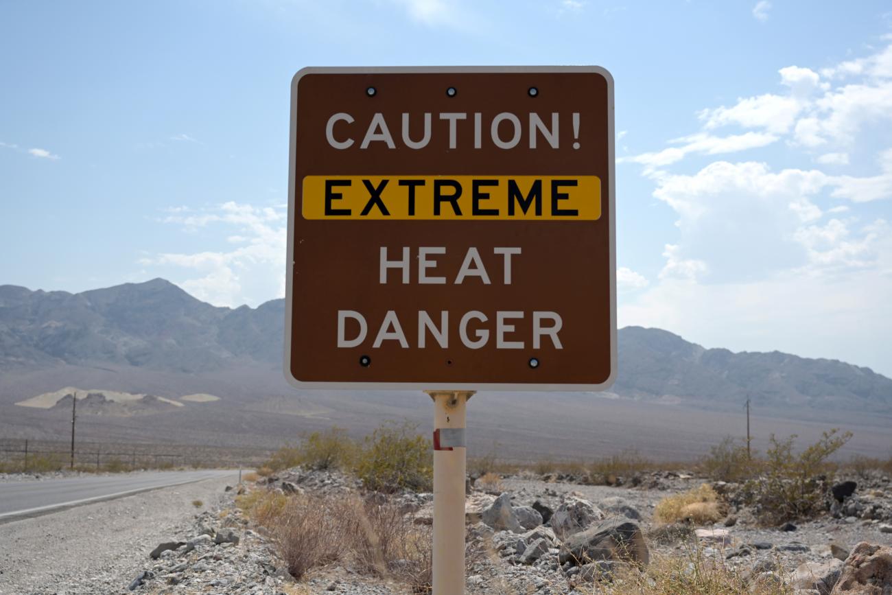 A sign warns of extreme heat in Death Valley, California, U.S., July 11, 2021