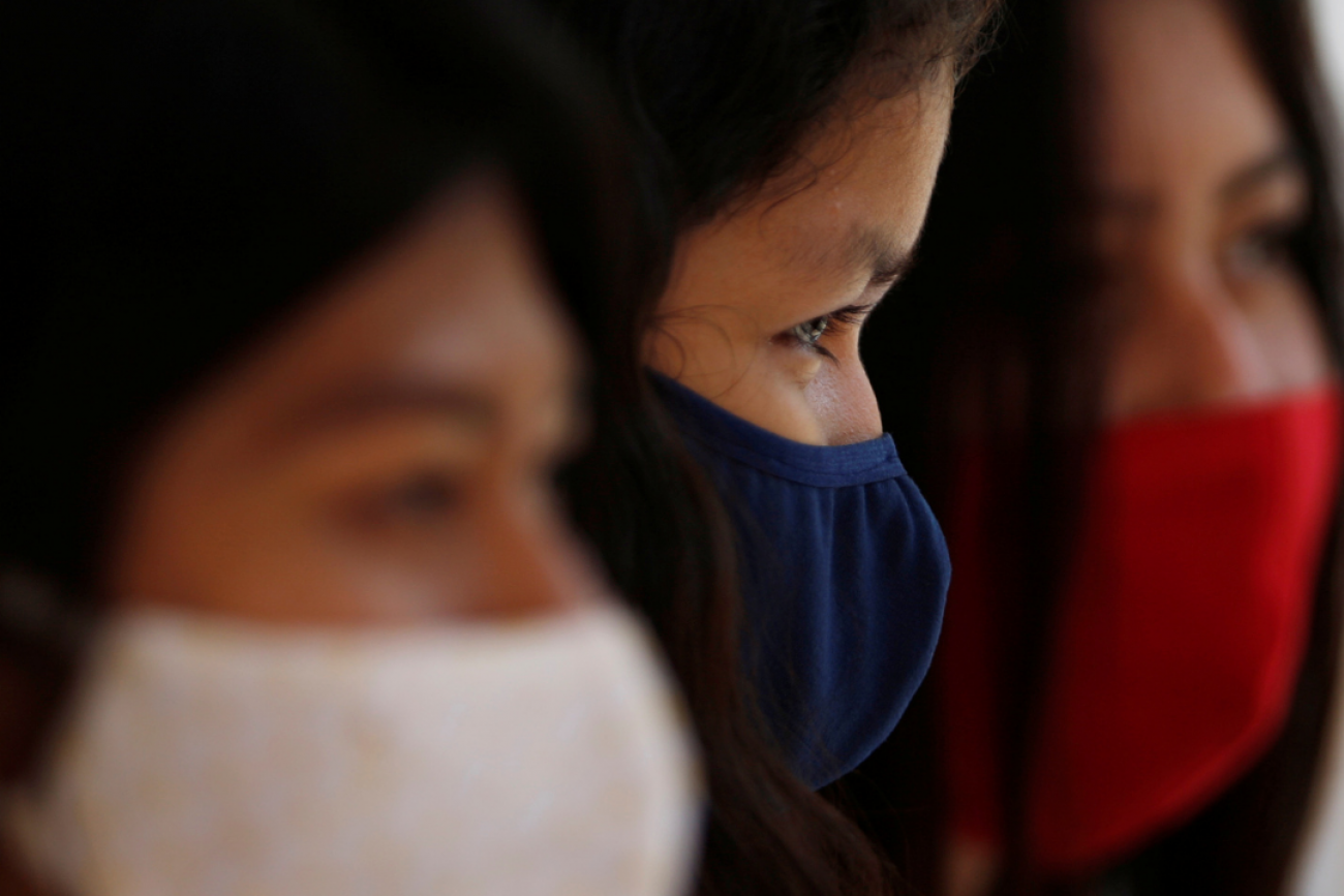 Guajajara women wear protective masks to prevent the spread of COVID at a community school in the village of Morro Branco in Maranhão, a state in northeastern Brazil on October 4, 2020. Photo by Adriano Machado with REUTERS