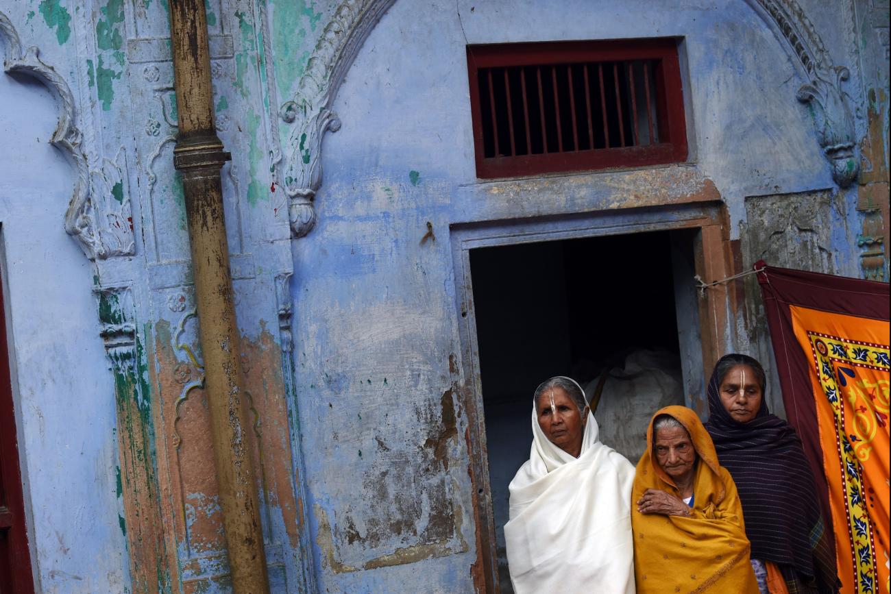 dian widows listen to a talk by Bindeshwar Pathak, founder of NGO Sulabh International which funds some Indian widows sheltering in ashrams in Vindravan on March 3, 2015. 