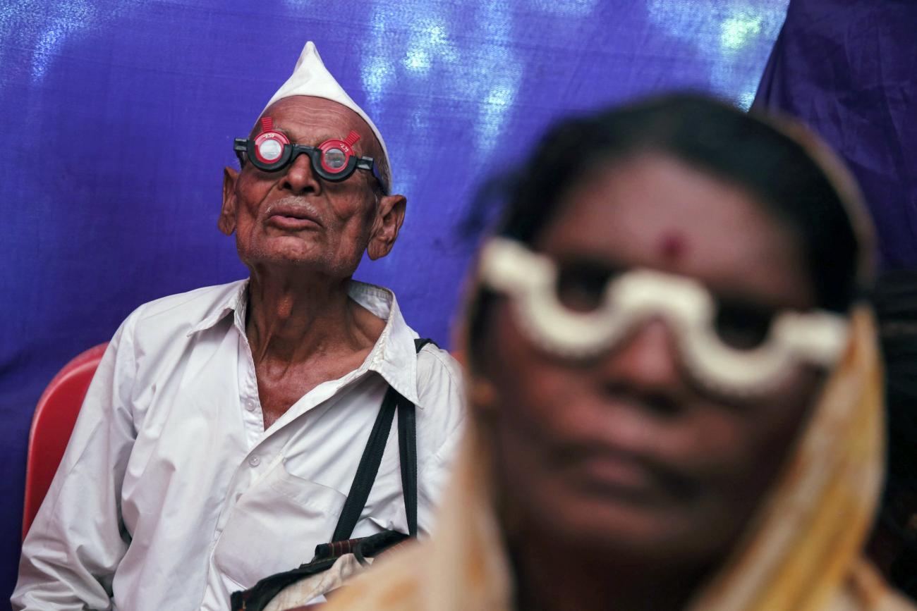 People get their eyes tested at a free eye-care camp, in Mumbai, India, on December 6, 2014.