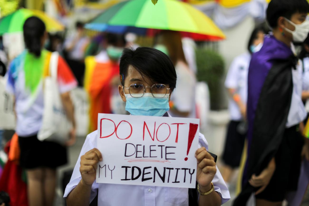 A member of a youth pride student group holds a placard before a rally for gender rights in Bangkok, Thailand, on July 29, 2020.