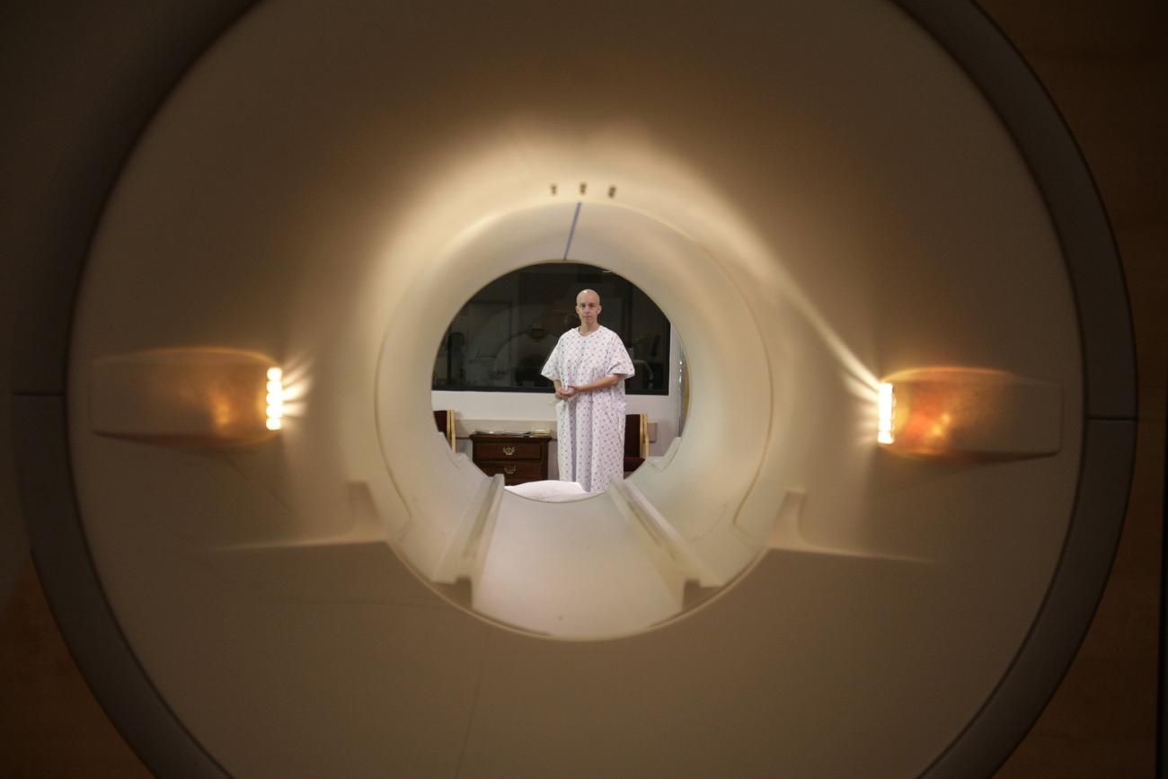 Cancer patient Deborah Charles is seen through the tube of a magnetic resonance imaging scanner as she prepares to enter the MRI machine for an examination at Georgetown University Hospital in Washington May 23, 2007. 