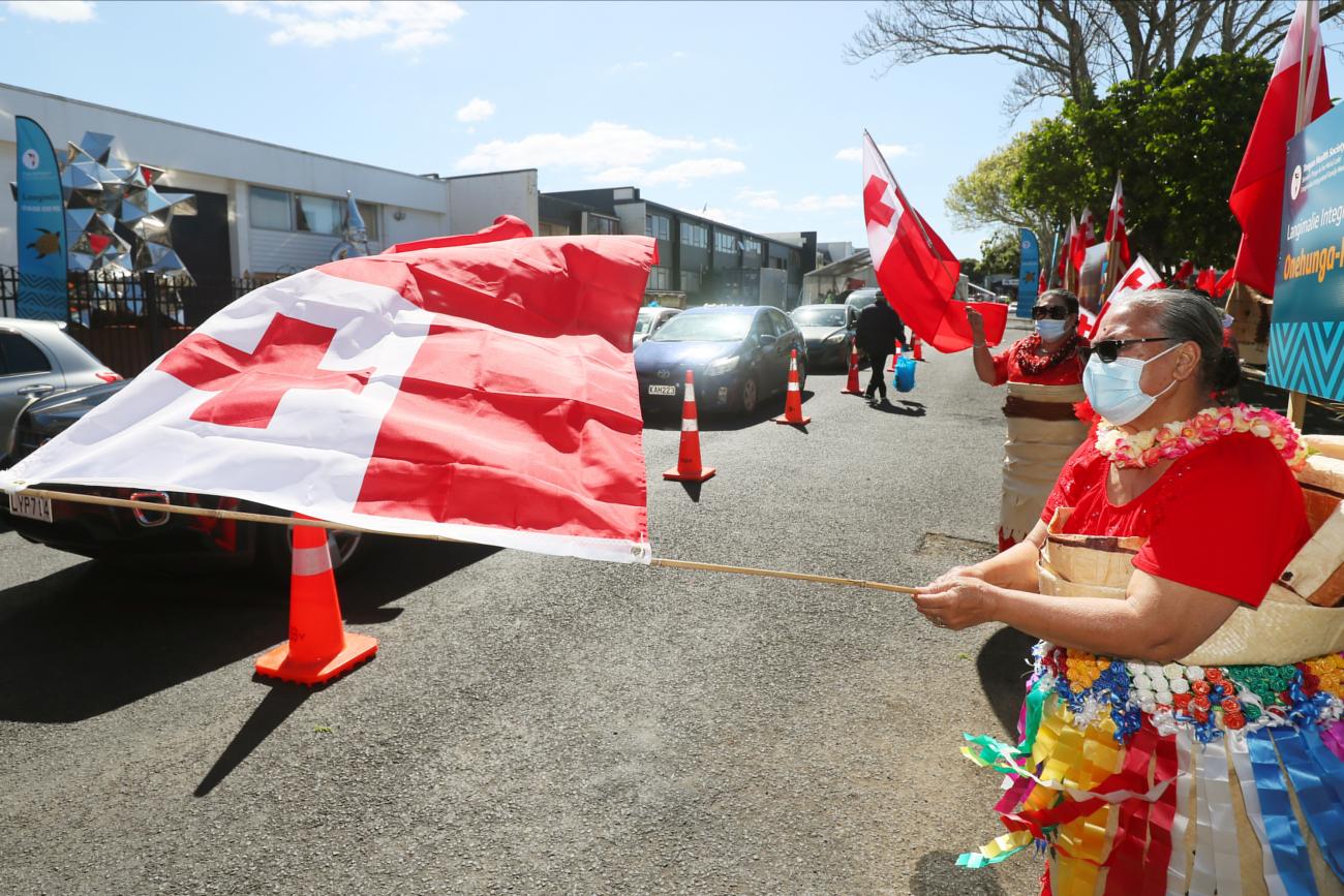Members of the Tongan community dance at a drive-through coronavirus disease (COVID-19) vaccination clinic in Onehunga during a single-day vaccination drive, aimed at significantly increasing the percentage of vaccinated people in the country, in Auckland, New Zealand, October 16, 2021.