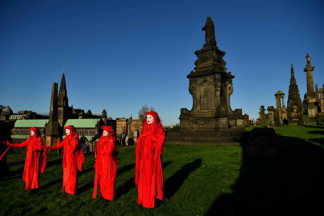 Activists take part in a mock funeral at Glasgow Necropolis during the UN Climate Change Conference (COP26) in Glasgow, Scotland, Britain November 13, 2021.
