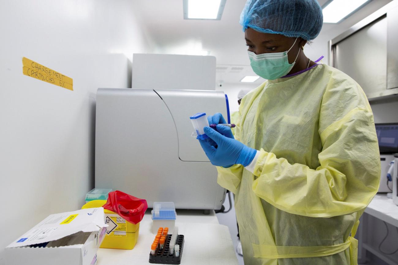 Noella Mulopo, a laboratory technician, writes on a GeneXpert Xpress SARS-CoV-2 coronavirus disease (COVID-19) testing cartridge in the National Institute for Biomedical Research laboratory (INRB) in Goma, Democratic Republic of Congo February 6, 2021.