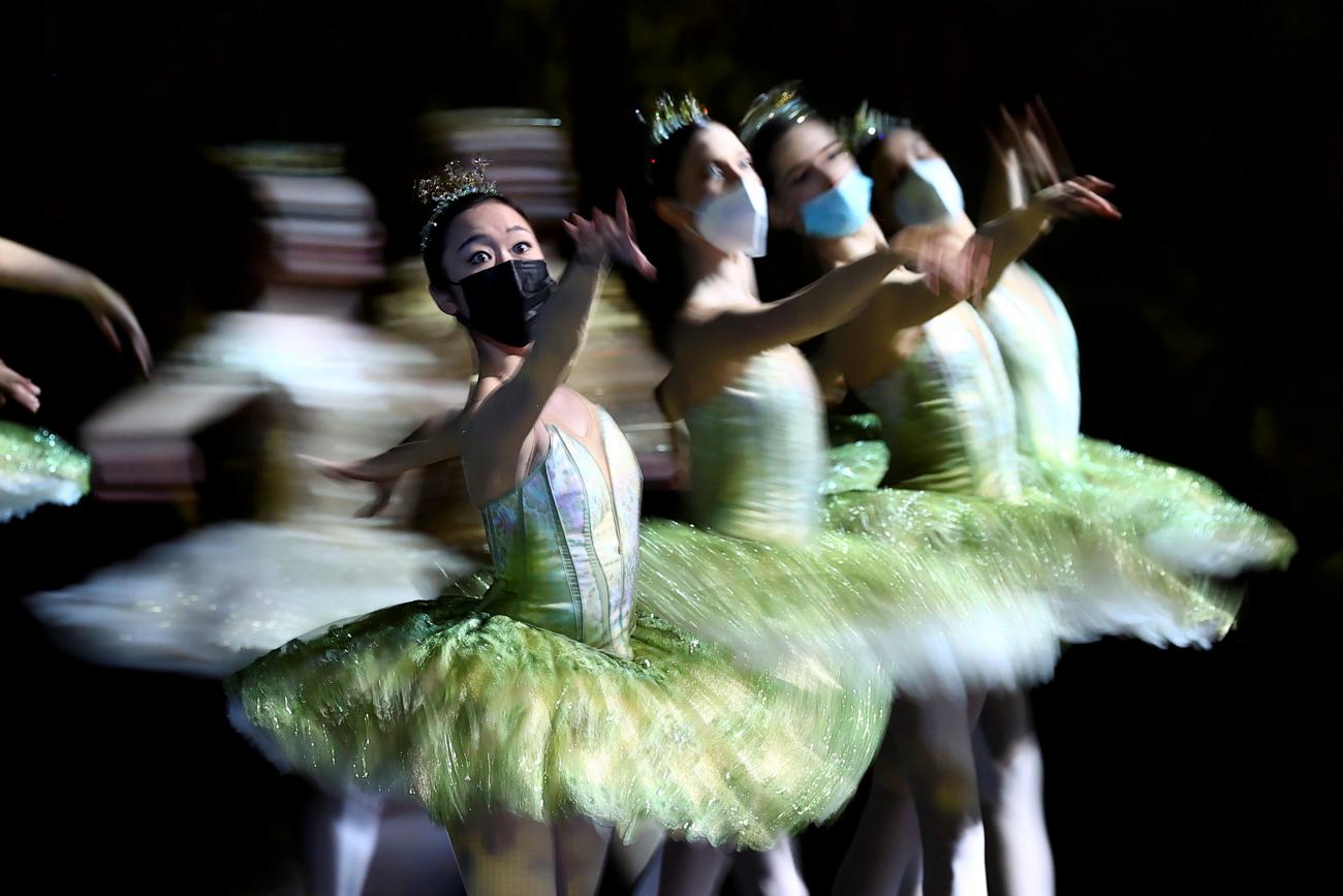 Dancers with the Berlin State Ballet (Staatsballett Berlin) wear face masks during a dress rehearsal of Don Quixote at Deutsche Oper Berlin, in Germany, on December 1, 2021.